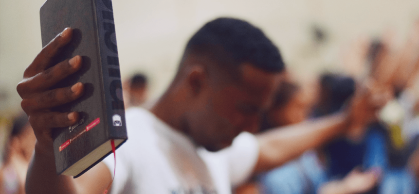 praying holding book praying holding book